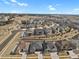 An aerial view showcases the layout of the neighborhood in a community setting at 12938 Bridge View Ln, Parker, CO 80134