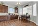 Cozy breakfast nook with a round table, seating for four, and bright natural light from surrounding windows at 12938 Bridge View Ln, Parker, CO 80134