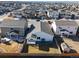 This aerial view features a well-maintained lawn, neighboring homes, and a fenced backyard at 2303 Angus St, Mead, CO 80542