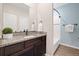 Bathroom with a granite countertop vanity, and a shower with a tub and white tile at 2303 Angus St, Mead, CO 80542