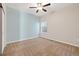 This spacious bedroom features a ceiling fan and a window with natural light at 2303 Angus St, Mead, CO 80542