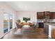 Charming dining area featuring a stylish table set, adjacent to the kitchen and patio access at 2303 Angus St, Mead, CO 80542