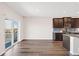 Bright, open kitchen area with sliding glass door, modern cabinets, and seamless access to outdoor space at 2303 Angus St, Mead, CO 80542