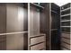 Walk-in closet features custom shelving, drawers, and ample storage space for clothing and accessories at 2303 Angus St, Mead, CO 80542