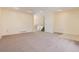 Open living area with neutral carpet and recessed lighting at 8152 S Everett St, Littleton, CO 80128