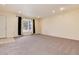 Bright living room with bay window, neutral carpet, and recessed lighting at 8152 S Everett St, Littleton, CO 80128