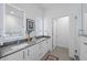 Modern bathroom with double sinks, sleek vanity, and decorative mirrors at 2525 Arapahoe St # Rd315, Denver, CO 80205