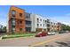 Modern exterior showcasing a multi-story building with brick, metal, and ample street parking at 2525 Arapahoe St # Rd315, Denver, CO 80205