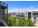 View of the modern apartment building with balconies and surrounding greenery from a balcony at 2525 Arapahoe St # Rd315, Denver, CO 80205