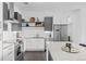 Modern kitchen featuring stainless steel appliances, quartz countertops and eat in bar at 2525 Arapahoe St # Rd315, Denver, CO 80205