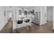 Stylish kitchen featuring stainless steel appliances, sleek cabinetry, and breakfast bar with modern seating at 2525 Arapahoe St # Rd315, Denver, CO 80205