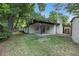 A well-maintained backyard with a patio and green lawn provides space for outdoor enjoyment at 10051 E Walsh Pl, Denver, CO 80247