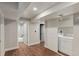 Finished basement area featuring a laundry area and access to a bathroom at 10051 E Walsh Pl, Denver, CO 80247