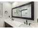 Elegant bathroom with a dual vanity, a large mirror, and a modern shower with white subway tile at 10051 E Walsh Pl, Denver, CO 80247