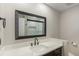 This bathroom has an undermount sink with black hardware, vanity, and modern mirror at 10051 E Walsh Pl, Denver, CO 80247