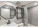 Cozy bathroom features a black framed mirror and shelving near the tub and shower at 10051 E Walsh Pl, Denver, CO 80247