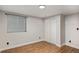 This bedroom features neutral walls, wood floors, and a closet for storage at 10051 E Walsh Pl, Denver, CO 80247
