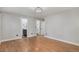 Serene bedroom with hardwood floors, closet, and an en-suite bathroom creating a private retreat at 10051 E Walsh Pl, Denver, CO 80247
