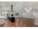 Modern kitchen featuring stainless steel appliances, a center island, and ample cabinet space at 10051 E Walsh Pl, Denver, CO 80247