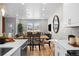 Open-concept living space with bright windows and views features a dining table at 17145 W 91St Ln, Arvada, CO 80007