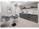 Basement area with bar, wine cooler, and seating, ideal for entertaining at 2395 N Emerson St, Denver, CO 80205