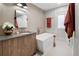 Elegant bathroom with a vessel tub, wood vanity with gray countertop, and modern fixtures at 2395 N Emerson St, Denver, CO 80205