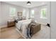 Bright bedroom with natural light, a comfortable bed, and stylish decor at 2395 N Emerson St, Denver, CO 80205
