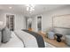 Spacious bedroom with hardwood floors, stylish furnishings, and modern lighting at 2395 N Emerson St, Denver, CO 80205