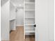 Walk-in closet with custom shelving and ample storage space at 2395 N Emerson St, Denver, CO 80205