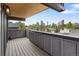 Large deck with wood flooring and views of the downtown skyline at 2395 N Emerson St, Denver, CO 80205
