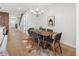 Dining room featuring modern lighting, wood floors, and a decorative rug at 2395 N Emerson St, Denver, CO 80205