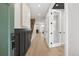 Inviting entryway with hardwood floors, detailed molding, and modern lighting at 2395 N Emerson St, Denver, CO 80205