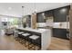 Bright, modern kitchen with a large island, quartz countertops, and stainless steel appliances at 2395 N Emerson St, Denver, CO 80205