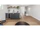 Entertaining area featuring bar with beverage fridge, wood floors and modern decor at 2395 N Emerson St, Denver, CO 80205