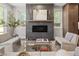 Modern living room with a fireplace, designer furniture, and natural light at 2395 N Emerson St, Denver, CO 80205