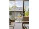 Covered outdoor patio with seating for four viewed through sliding glass doors at 2395 N Emerson St, Denver, CO 80205