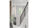 Staircase showing contemporary design with metal railings and natural light at 2395 N Emerson St, Denver, CO 80205
