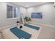 Serene yoga room with mats, natural light, and minimalist decor at 2395 N Emerson St, Denver, CO 80205