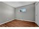 Clean and bright bedroom with hardwood floors, perfect for relaxation or study at 3802 E Costilla Ave, Centennial, CO 80122