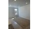 Well-lit bedroom with plush carpet, recessed lighting, and a large window at 6750 Juniper Dr, Thornton, CO 80602
