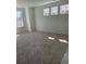 Carpeted bedroom with three large windows providing ample natural light at 6750 Juniper Dr, Thornton, CO 80602