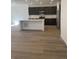 Modern kitchen featuring stainless steel appliances, a large island, and sleek cabinetry at 6750 Juniper Dr, Thornton, CO 80602