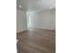 Bright, spacious living room with hardwood floors and ample natural light at 6750 Juniper Dr, Thornton, CO 80602