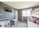 bedroom with bunk beds and play kitchen at 529 Olympia Ave, Longmont, CO 80504