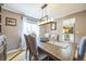 Dining room with wood table, chandelier, and hardwood floors at 529 Olympia Ave, Longmont, CO 80504
