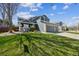 Attractive two-story home featuring a lush lawn, three-car garage, and inviting curb appeal at 529 Olympia Ave, Longmont, CO 80504