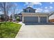 Charming two-story home with a three-car garage and a beautifully landscaped front yard at 529 Olympia Ave, Longmont, CO 80504