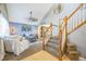 Open layout showcasing the living room, complete with a ceiling fan and a cozy seating arrangement at 529 Olympia Ave, Longmont, CO 80504