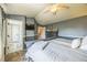 Comfortable main bedroom showcases a TV, attached bath and an open floor plan, and modern decor at 529 Olympia Ave, Longmont, CO 80504