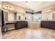 Large bathroom features tiled floors, double vanity, large tub, and windows at 11602 Pine Canyon Dr, Parker, CO 80138